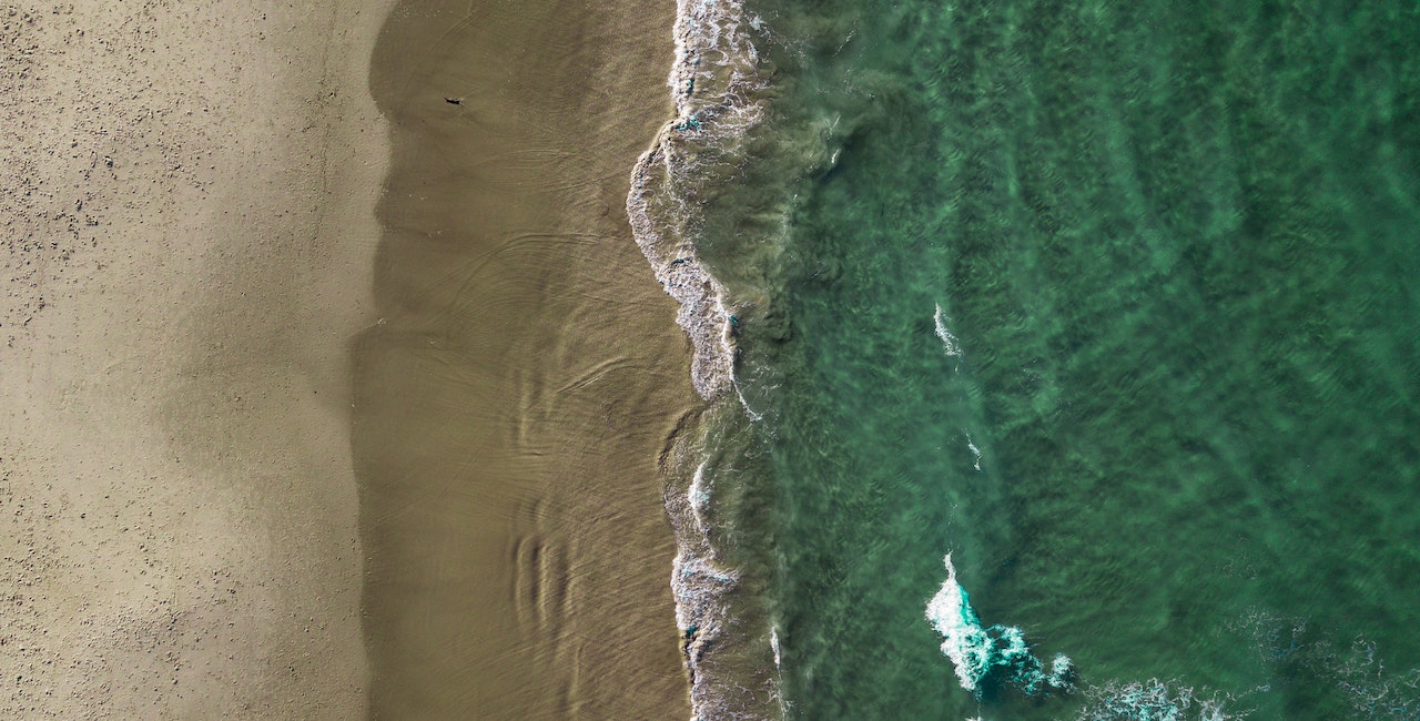 Aerial photo of a beach and sea.