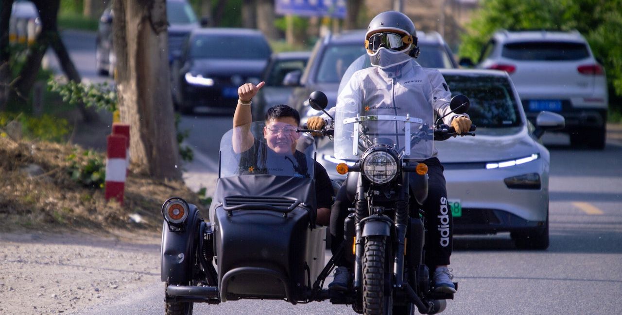 A motorcycle with a sidecar on a road.