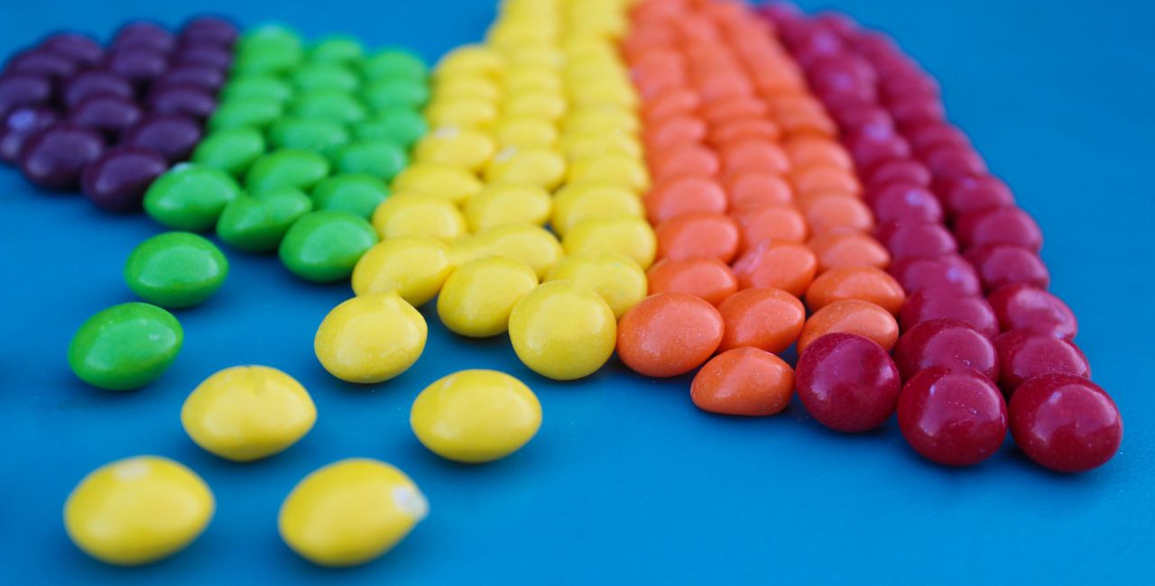 Photo of candy grouped by colors.