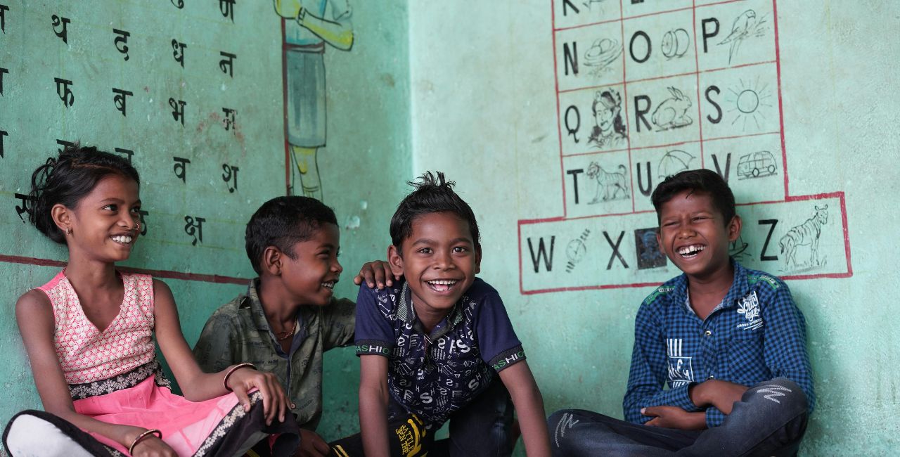 Children sitting in a classroom.