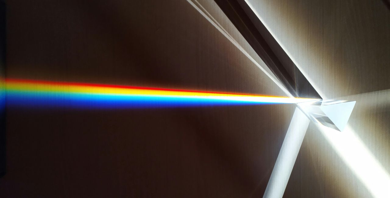 Prism splitting white light into its component colors.